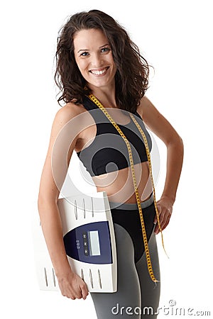 Sporty woman with scale Stock Photo