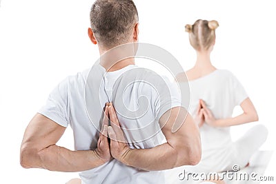 Sporty young people sitting in lotus position with namaste mudra sign Stock Photo