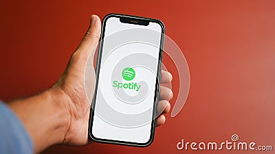 Spotify music app on the smartphone, app for music, radio and podcast streaming Editorial Stock Photo
