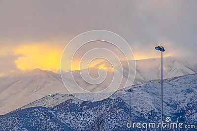 Spotlight against snowy Utah mountain at sunset Stock Photo