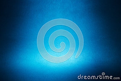 Spotlight on a blue wall Stock Photo