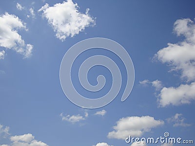 Spotty clouds on blue sky background Stock Photo