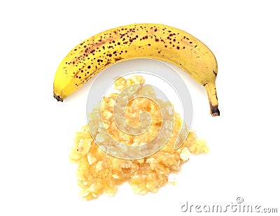 Spotty ripe whole banana with mashed fruit Stock Photo