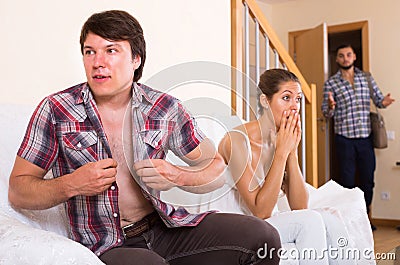 Spouse having affair with unfaithful woman Stock Photo