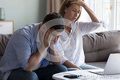 Spouses manage finances, analyze expenses, check budget looks disappointed Stock Photo