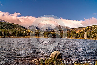 Sprague Lake with Fall Aspens and Clouds Stock Photo