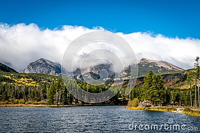 Sprague Lake with Fall Aspens and Clouds Stock Photo