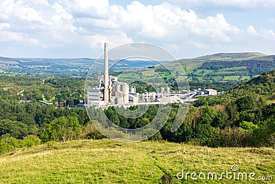 sprawling industrial complex amidst the serene countryside , stark contrast between nature and production Editorial Stock Photo