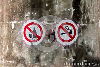 Spray paint of No smoking and no alcohol sign on old concrete wall background. Stock Photo