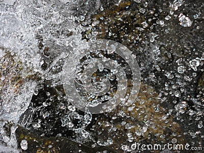 The spray of water on the stones Stock Photo