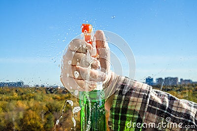 spraying the detergent on glass Stock Photo