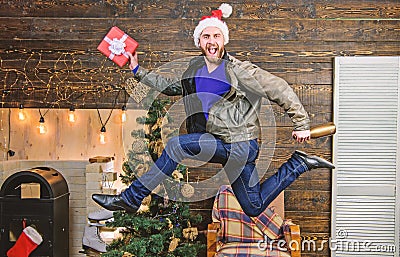 Spread happiness and joy. Bearded guy in motion jump. Delivery christmas present. Still have time. Delivery service Stock Photo