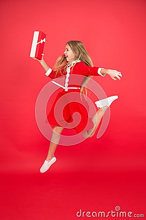 Spread happiness and joy. Little child in motion jump. Delivery christmas present. Gifts delivery. Delivery service Stock Photo