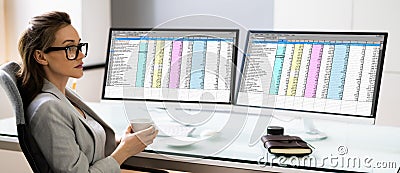 Spreadsheet Analyst Employee Using Computer Monitors Stock Photo