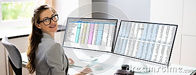 Spreadsheet Analyst Employee Using Computer Monitors Stock Photo