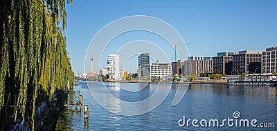 Spree river east side at Berlin, Germany. Industrial area, tv tower and Oberbaum bridge. Panoramic view, banner Stock Photo