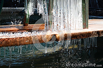 Spring ice handmade waterfall and it`s teardrop Stock Photo