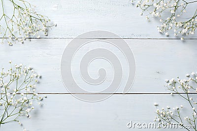 Spring background, flowers frame on blue wooden table. Banner mockup for Womans or Mothers Day, Easter, spring holidays. Flat lay, Stock Photo