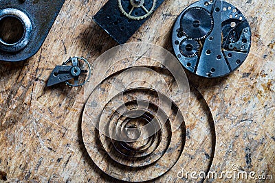 Spring, balance wheel and clockworks on a table Stock Photo