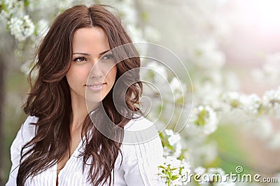 Spring beauty girl. Beautiful young woman in a summer park outdo Stock Photo