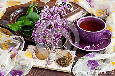 Spring branch lilac flowers on rustic wooden table Stock Photo