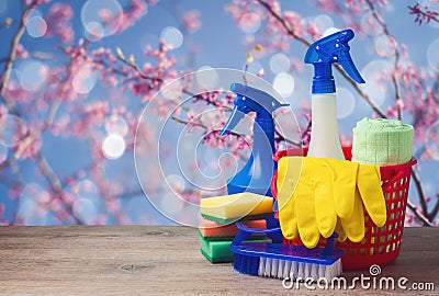 Spring cleaning concept with supplies over floral background Stock Photo