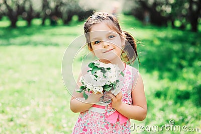 Spring closeup outdoor portrait of adorable kid girl Stock Photo