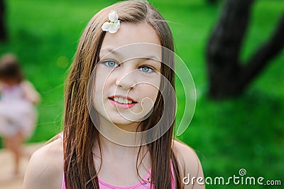 Spring closeup outdoor portrait of adorable 11 years old preteen kid girl Stock Photo