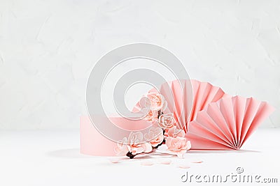 Spring cylinder podium mockup decorated of semicircle asian fans, twig pink sakura flowers, petals in light white interior, japane Stock Photo