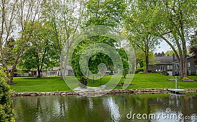 Spring day in Canton, Ohio, USA. Holiday homes, green grass and trees Editorial Stock Photo