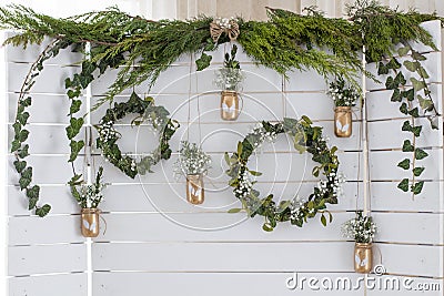 Spring decor. Easter decor. Photozone. A wreath of leaves on a wooden white background. Stock Photo