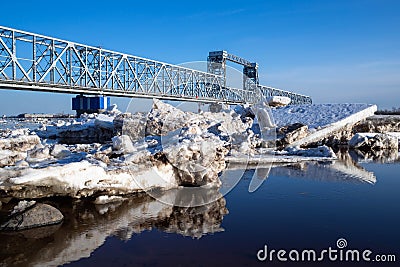 Spring evening in Arkhangelsk. Ice drift on the Severnaya Dvina river. The world`s northernmost drawbridge Stock Photo