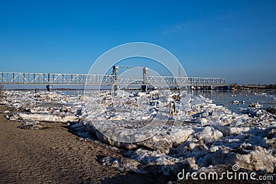 Spring evening in Arkhangelsk. Ice drift on the Severnaya Dvina river. The world`s northernmost drawbridge Stock Photo