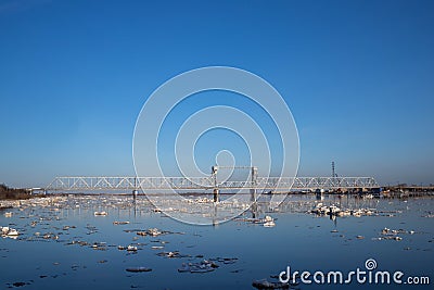 Spring evening in Arkhangelsk. Ice drift on the Severnaya Dvina river. The world`s northernmost drawbridge Stock Photo