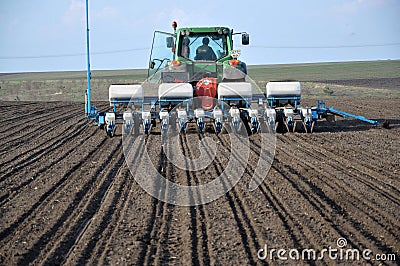 Spring field and seeder Editorial Stock Photo