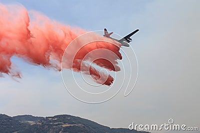 Spring Fire ~ 2013 ~ Plane Dropping Fire Retardant Editorial Stock Photo