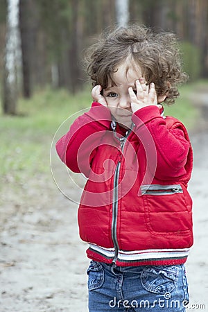 Spring in the forest distressed little girl. Stock Photo