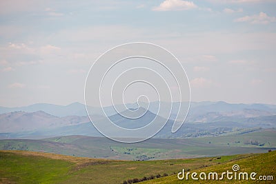 Altai mountain range on the horizon in colors, as in the paintings of Roerich Stock Photo