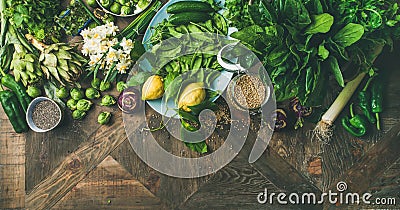 Spring healthy vegan food cooking ingredients, wooden background, wide composition Stock Photo