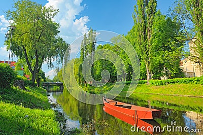 Spring landscape with boat on the Narew river. Stock Photo