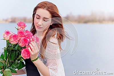 Romantic woman with bouquet of flowers Stock Photo