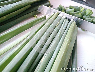 Spring onion chopping Stock Photo