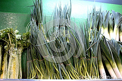Spring onions arranged vertically in a supermarket. Stock Photo