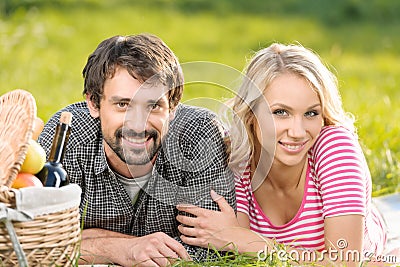 Spring picnic. Loving young couple enjoying a romantic picnic in Stock Photo