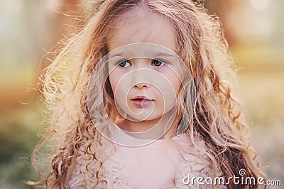 Spring portrait of beautiful dreamy curly 5 years old child girl Stock Photo