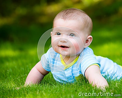 Spring portrait of happy baby boy outdoors Stock Photo