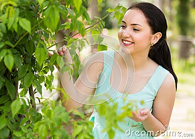 Spring positive smiling young female portrait in garden Stock Photo
