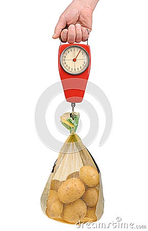 Spring scale with a bag of potatoes Stock Photo