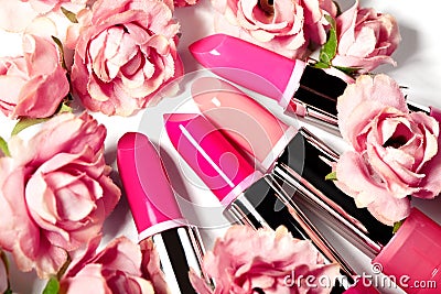 Spring set of lipsticks in pink flowers. Beauty cosmetic collection. Fashion trends in cosmetics, bright lips Stock Photo