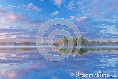 Spring Sunrise Whitford Lake with Reflections in Calm Water Stock Photo